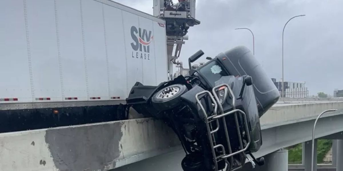Driver left dangling off I-65 bridge in Louisville crash, pulled to safety by fire crew